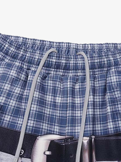 Close-up of the plaid waistband and graphic detail on the sweatpants