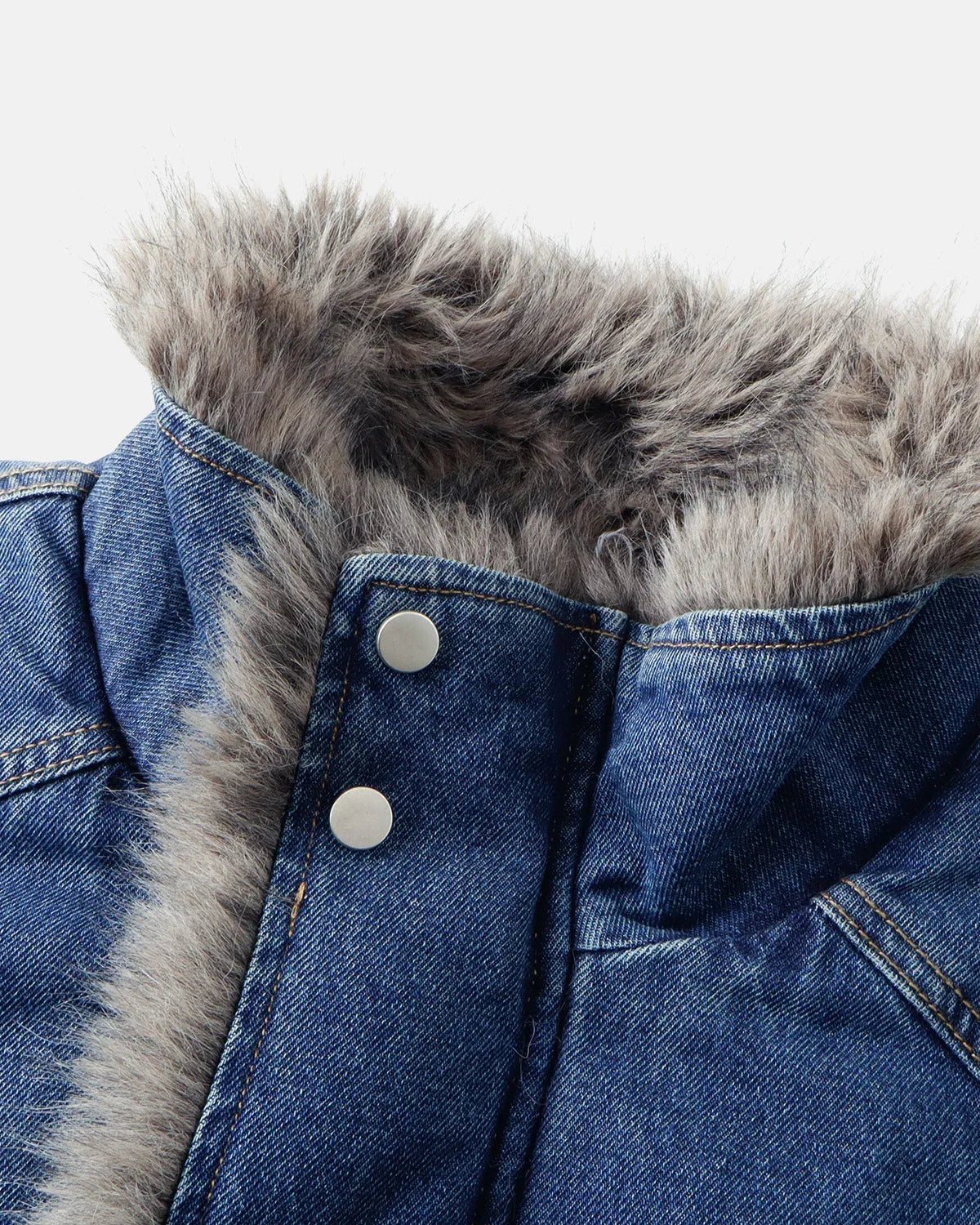Close-up of the quilted padding on a faux fur denim jacket