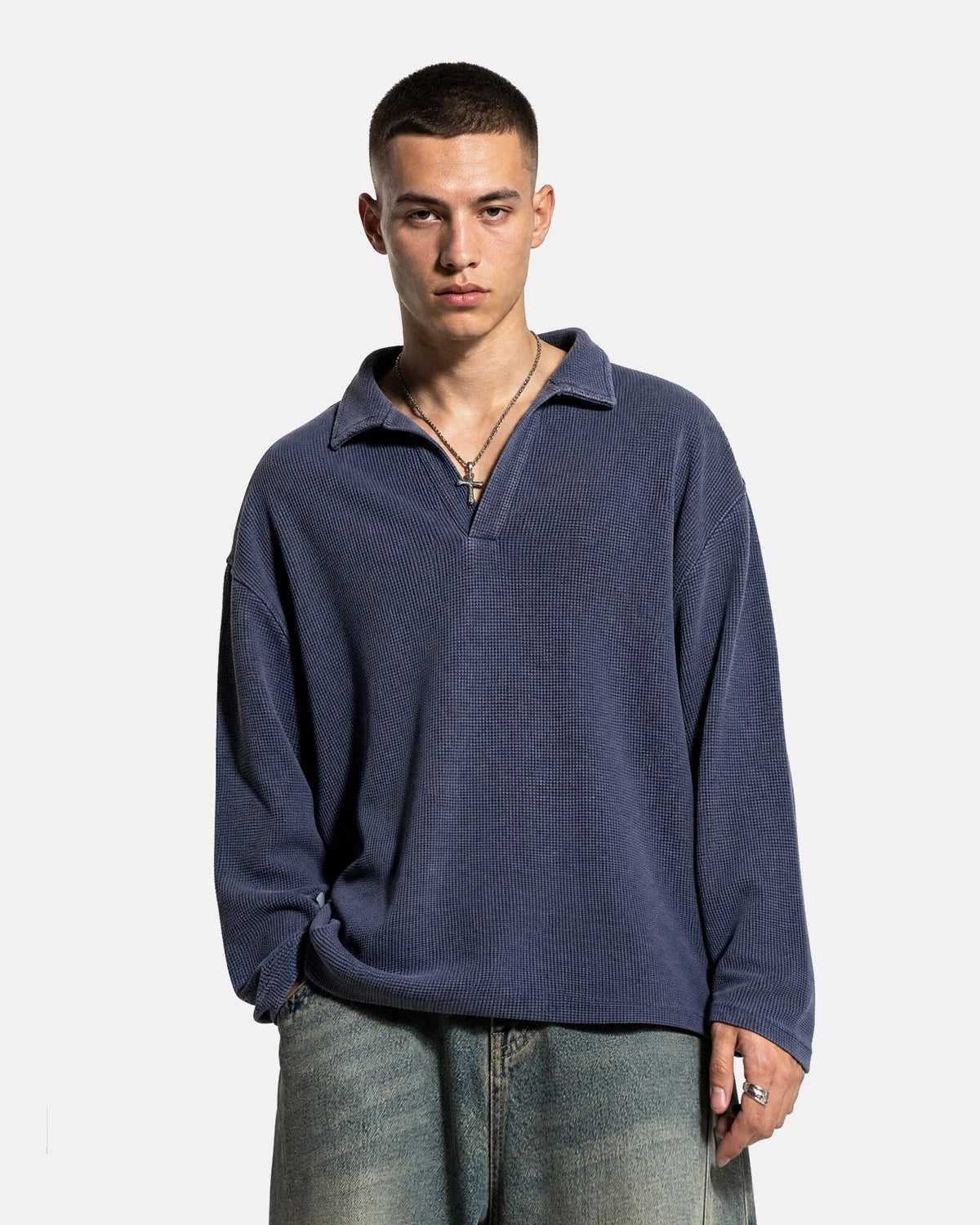 Close-up of the textured waffle knit on a washed polo shirt