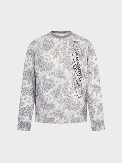 Distressed leopard print long-sleeve top shown from the front