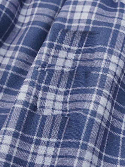 Back view of graphic sweatpants with a wide-leg cut and plaid waistband