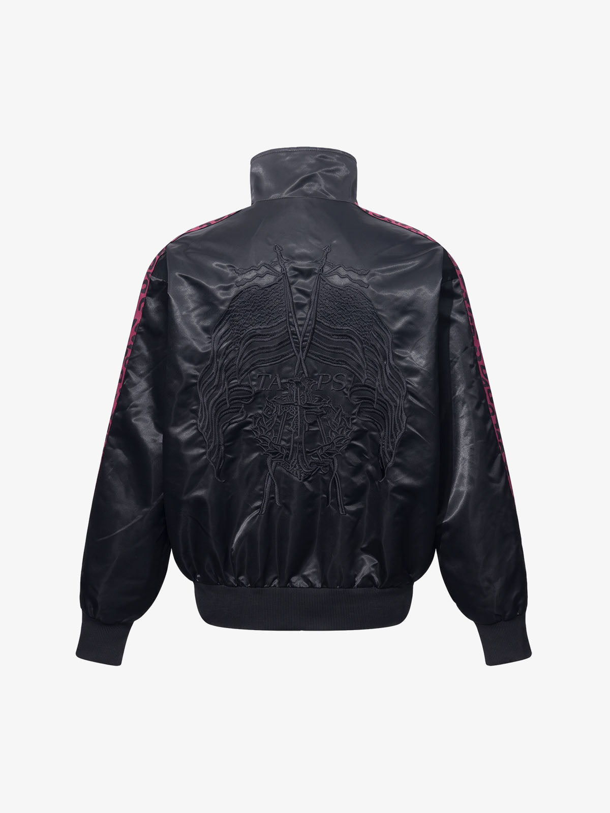 Close-up of the embroidered butterfly detail on the satin jacket