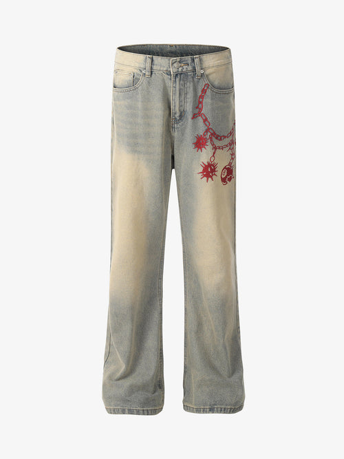 Distressed wide-leg jeans with red embroidered detail on the front