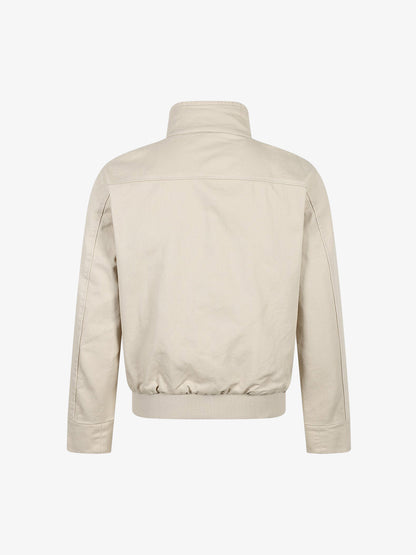 Cropped utility jacket showing the front pockets and structured shape