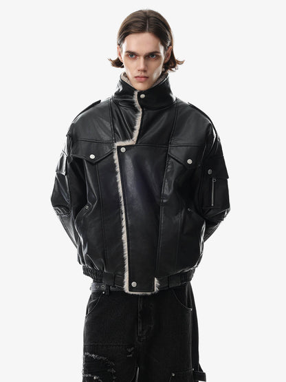 Front fastening detail on an oversized faux-leather coat