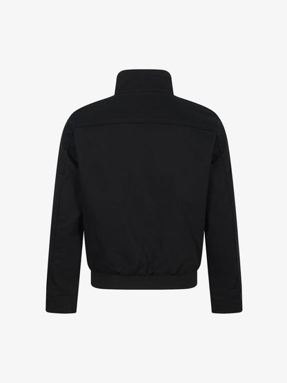 Techwear work jacket featuring a cropped fit and button fastening