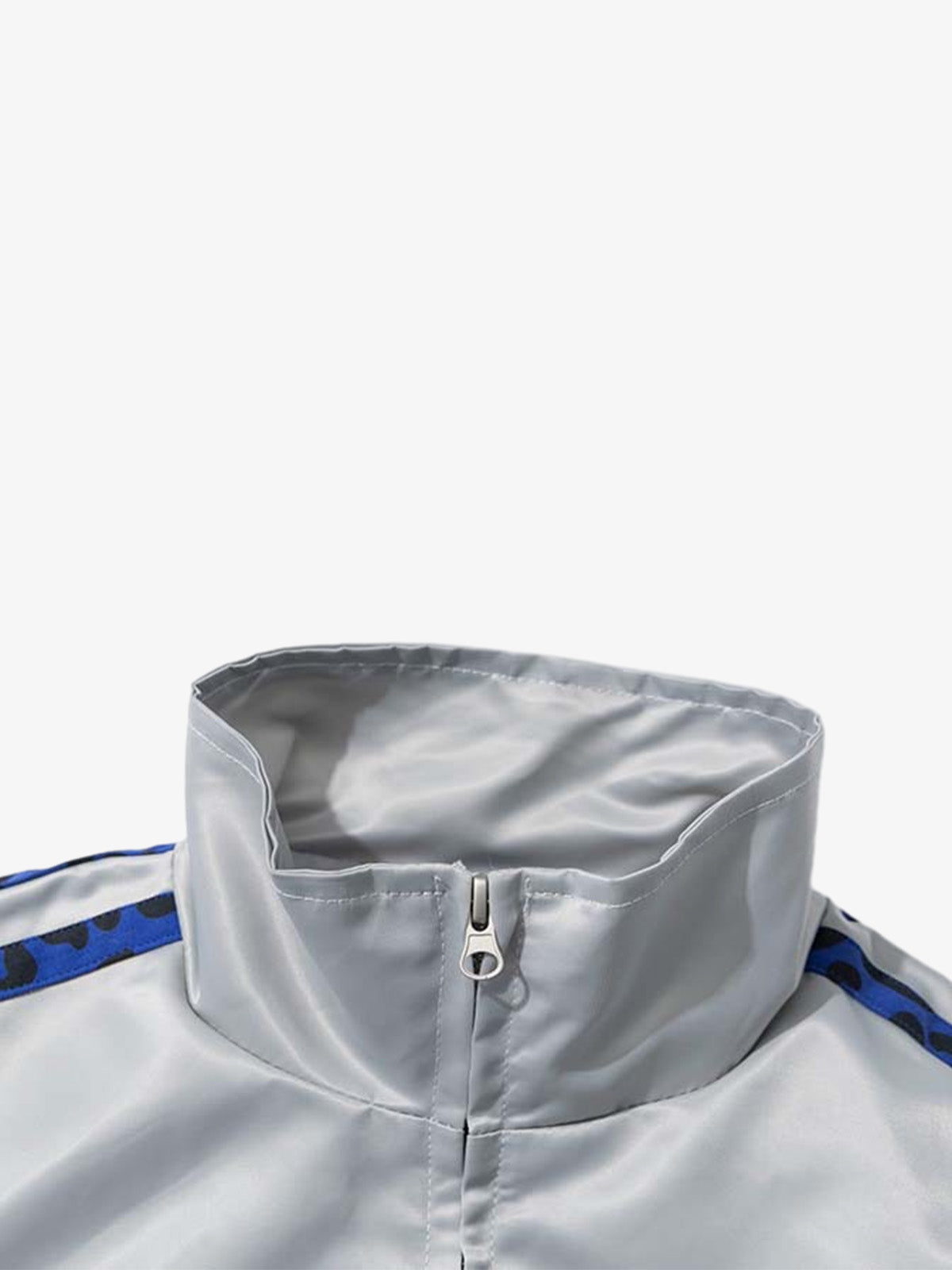 Detail of the leopard-print trim on the butterfly satin zip jacket