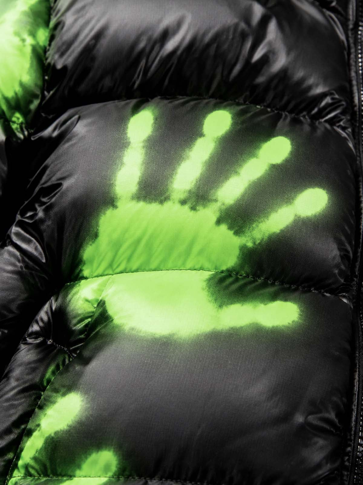 Heat-reactive fabric detail showing the coat changing colour
