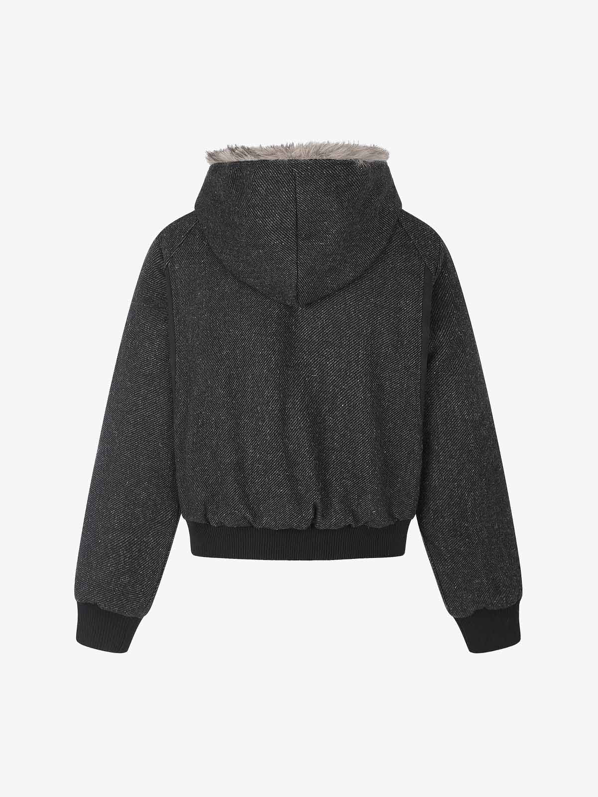 Rear view of the hooded coat with its clean, tailored shape