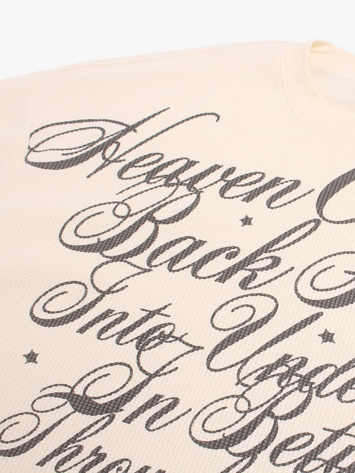 Full view of the script-print top styled for everyday wear