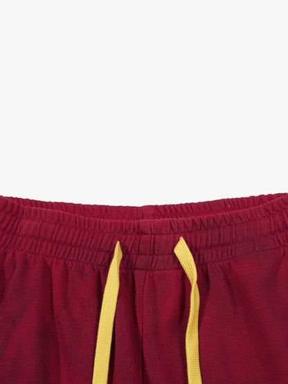 Crest graphic detail on the leg of the sweatpants