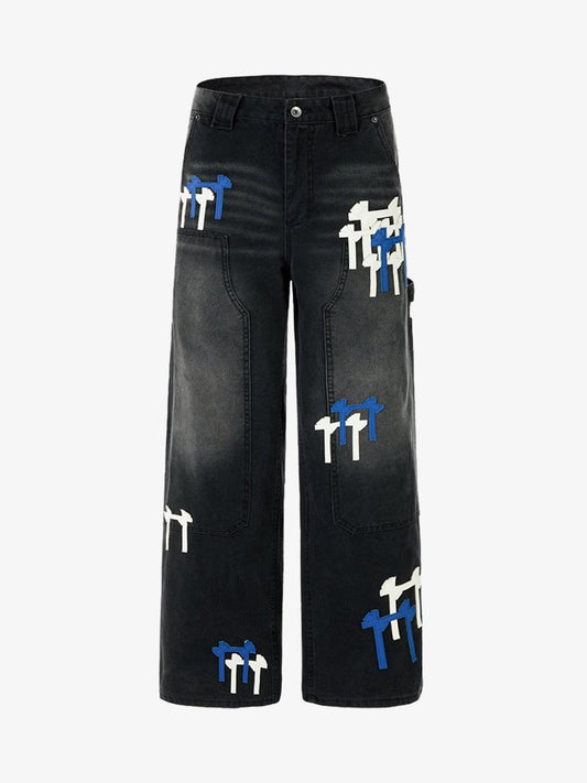 Front view of colour-block wide-leg denim jeans with patchwork details