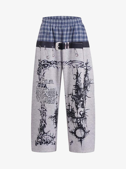 Wide-leg graphic sweatpants with a plaid waistband shown from the front