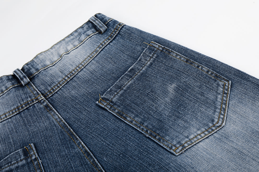 Rhinestone stars arranged across the leg of baggy jeans
