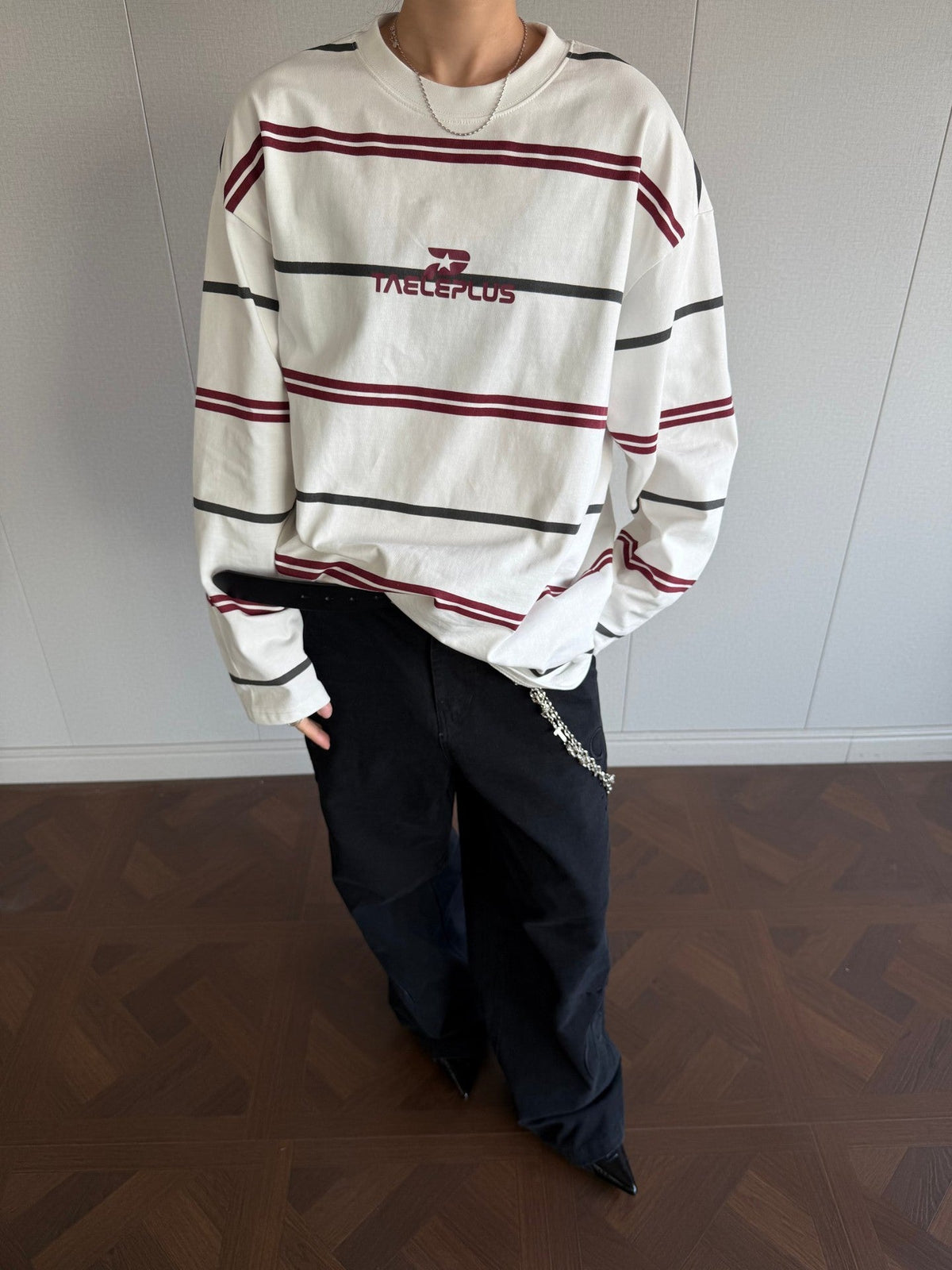Front view of a black and blue striped mock neck shirt