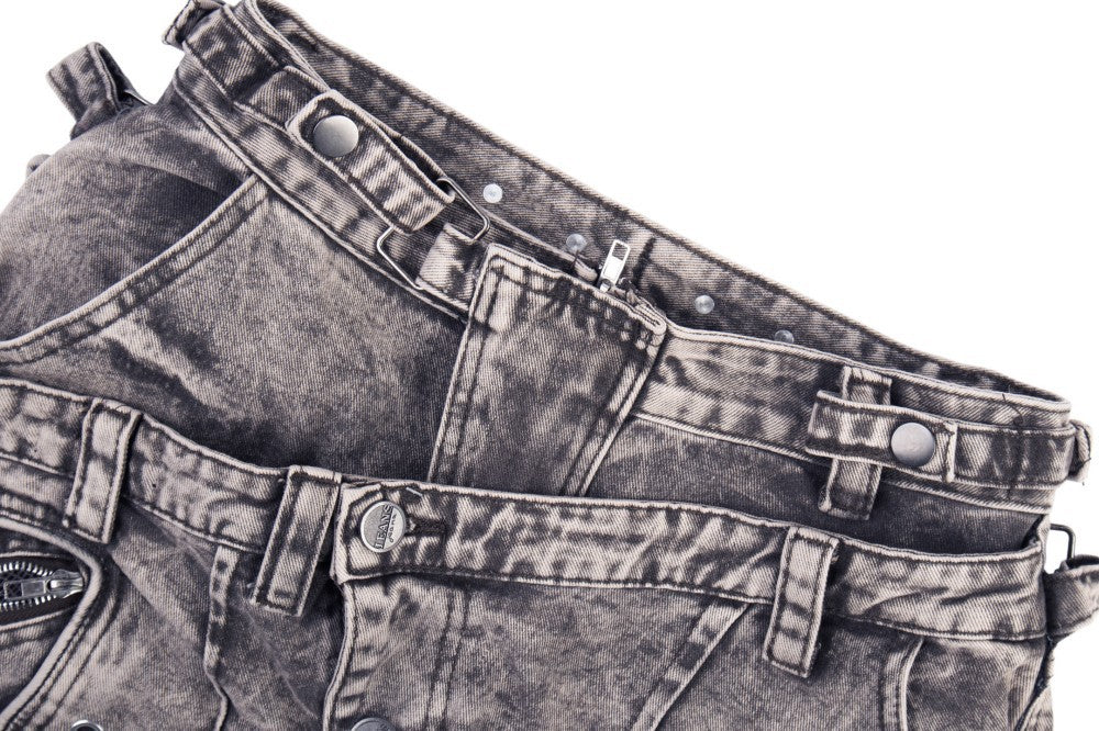 Denim jeans displayed to highlight the wide leg fit and waist panel