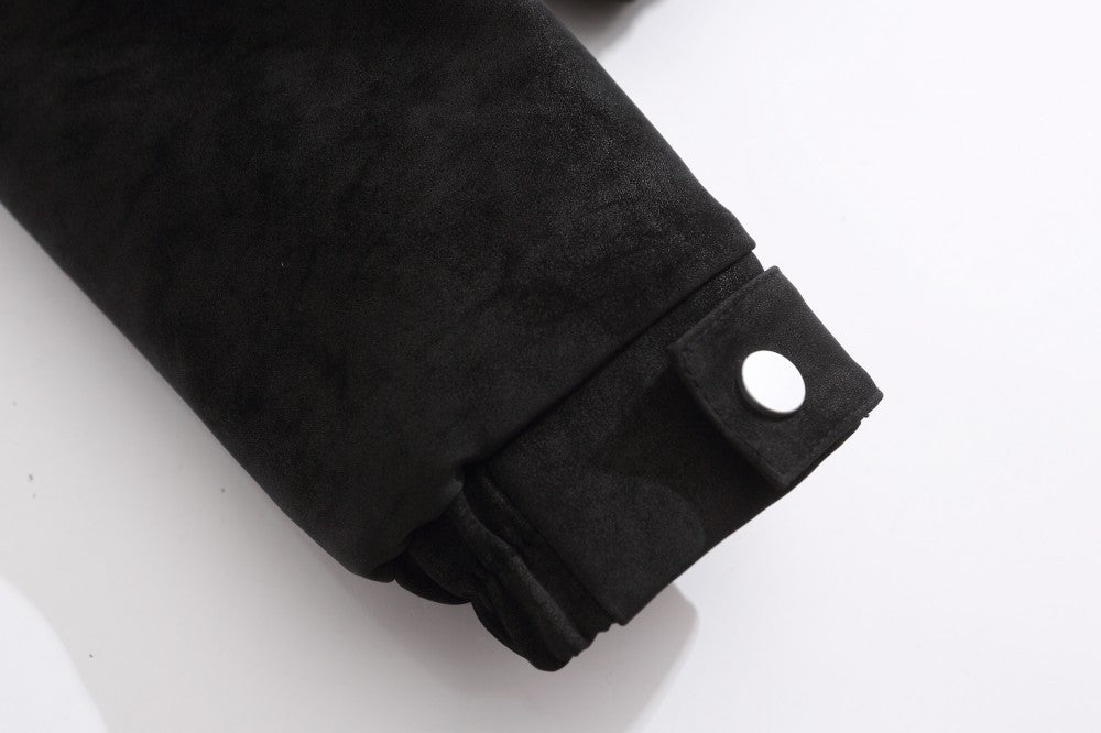 Close-up of the suede fabric and quilted stitching