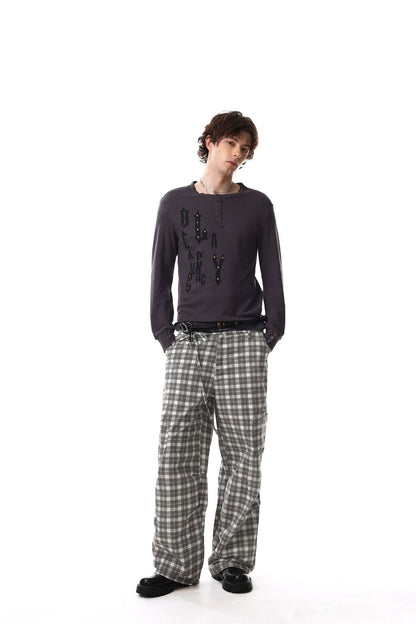 Long-sleeve Henley shirt showing its button placket and stud detail