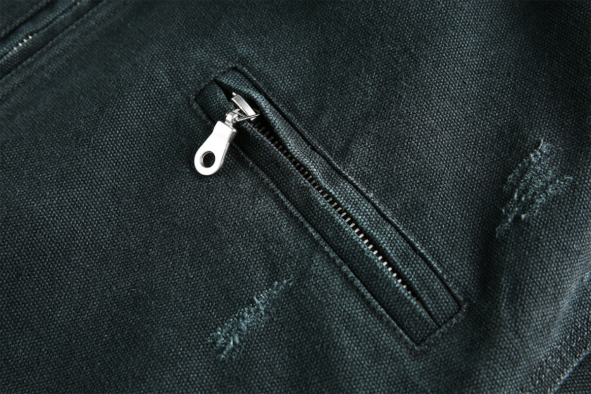 Back view of the acid-wash canvas jacket with its workwear silhouette