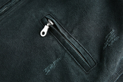Back view of the acid-wash canvas jacket with its workwear silhouette
