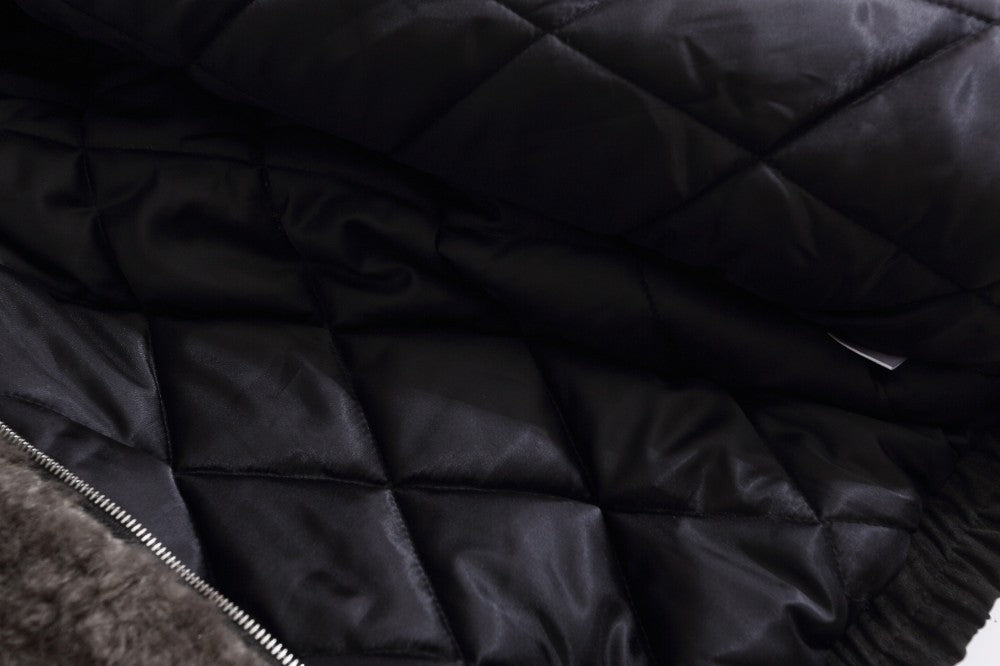 Side view of the suede quilted jacket with faux fur trim
