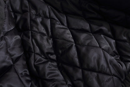 Jacket sleeve detail showing the quilted suede construction