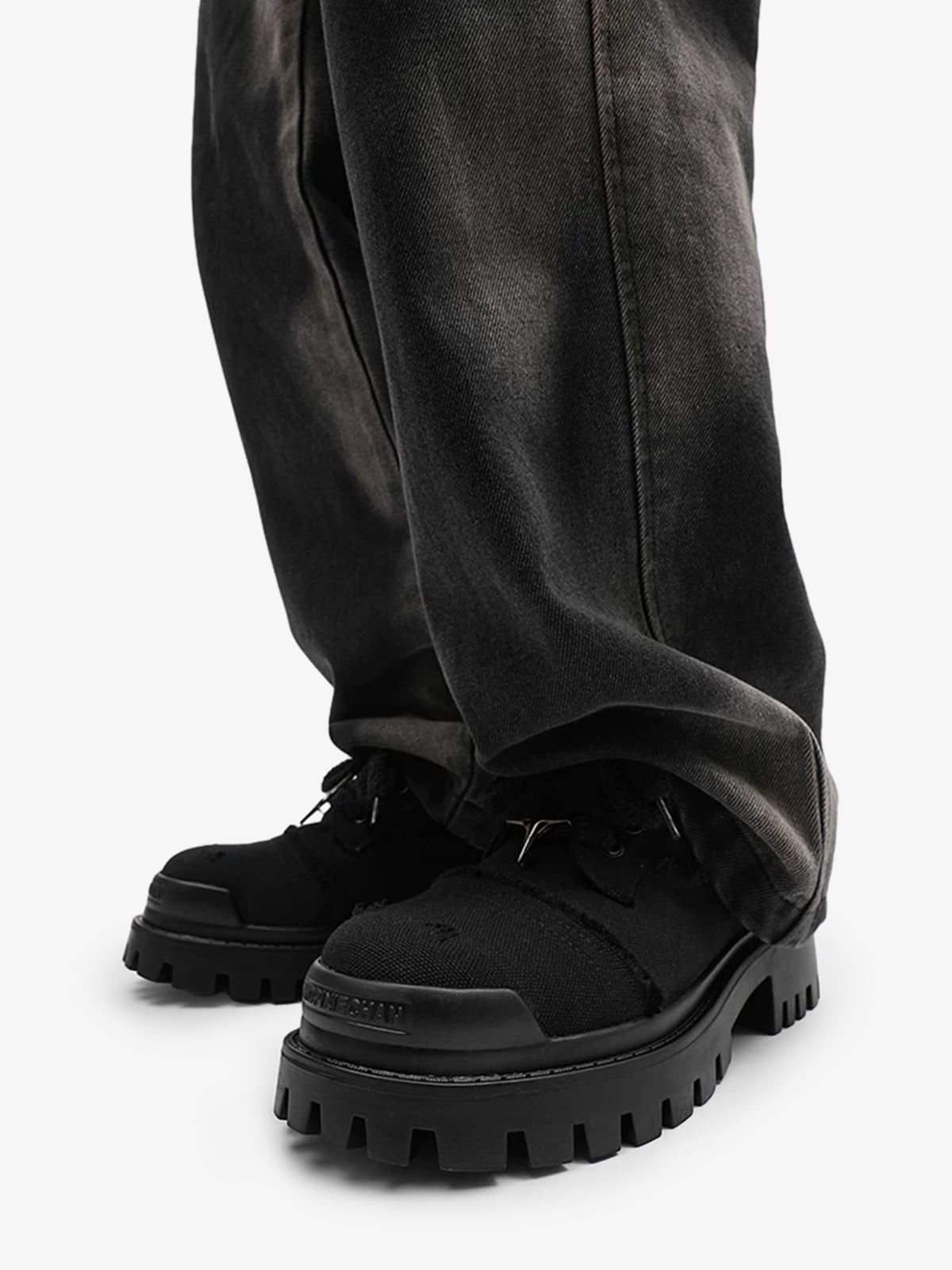 Chunky denim trainers showing the lace-up front and padded collar