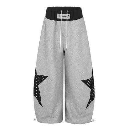 Close-up of the layered waist detail on baggy sweatpants