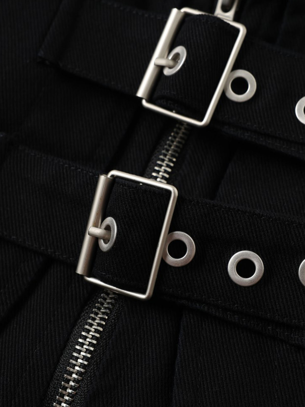 Back view of the cropped work jacket displaying its clean, practical design