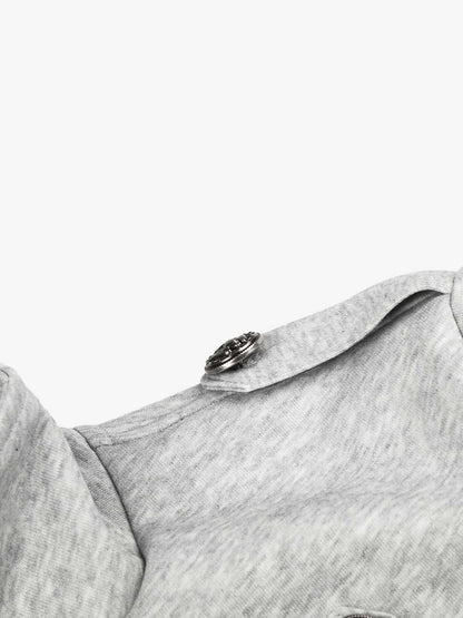 Full-length view of the double-breasted boxy jacket styled for layering