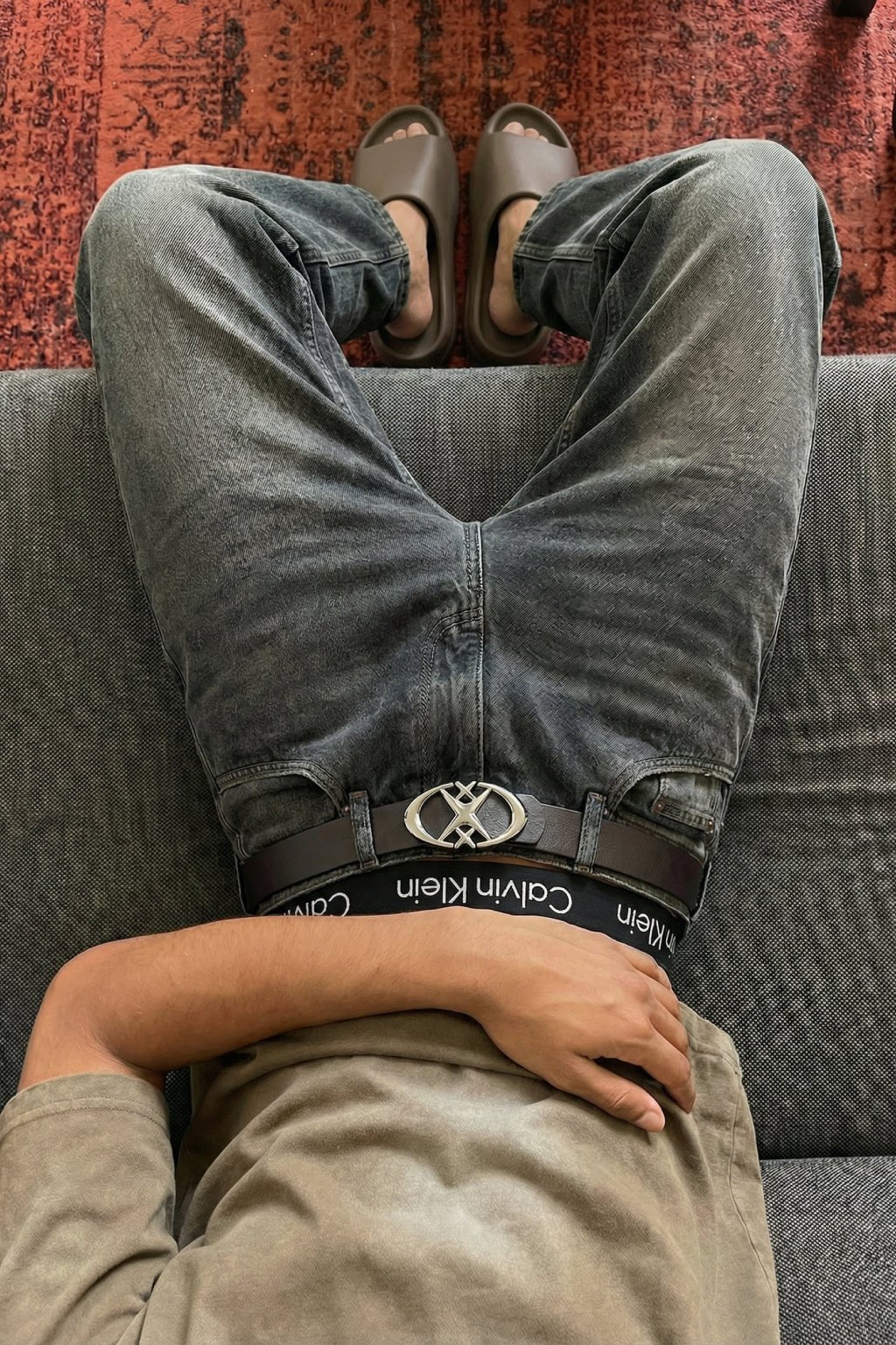 Star and cross streetwear belt displayed as a versatile outfit accessory