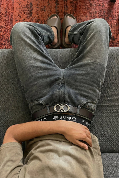Star and cross streetwear belt displayed as a versatile outfit accessory