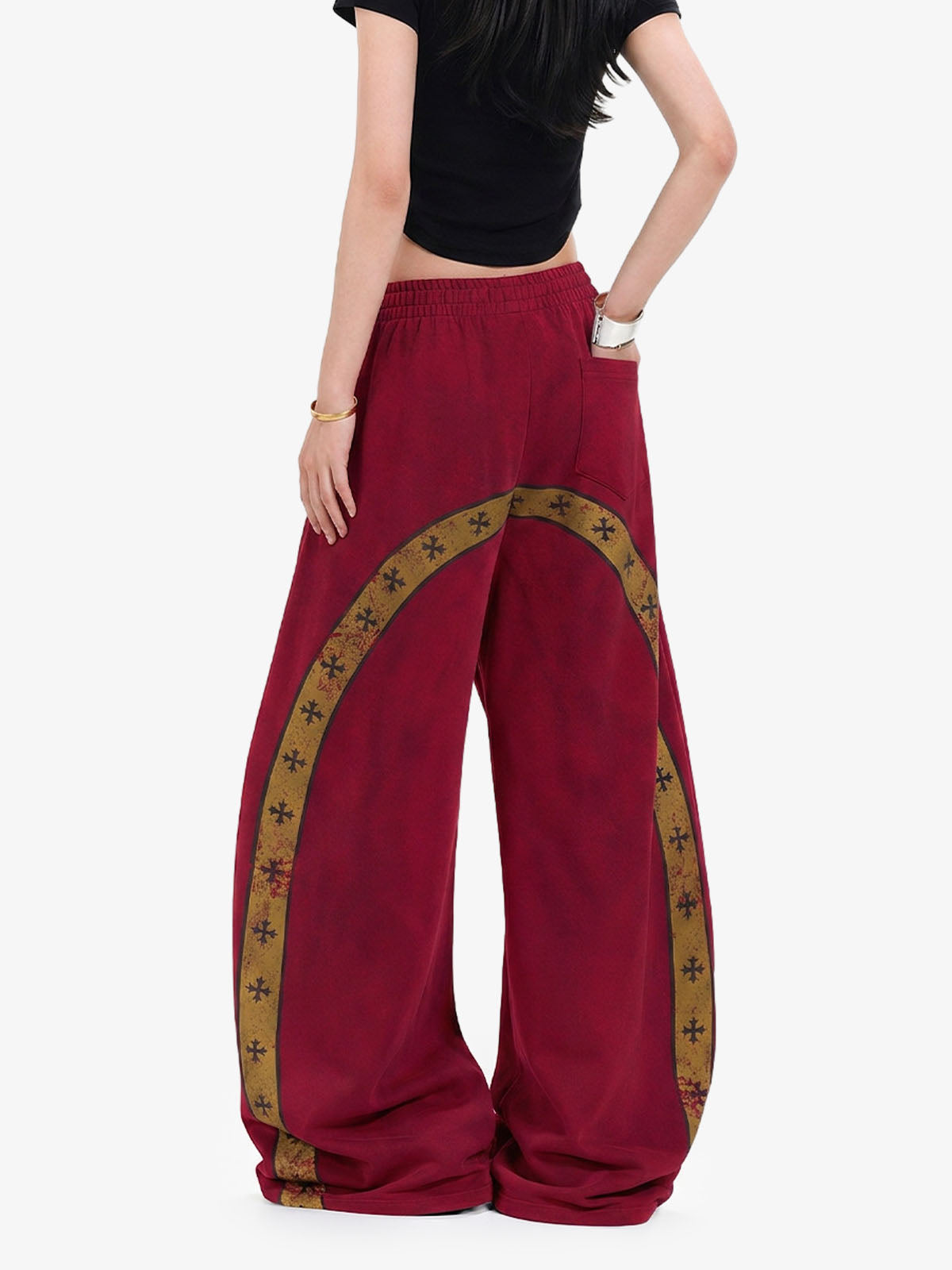 Waistband detail on wide-leg sweatpants with crest graphic