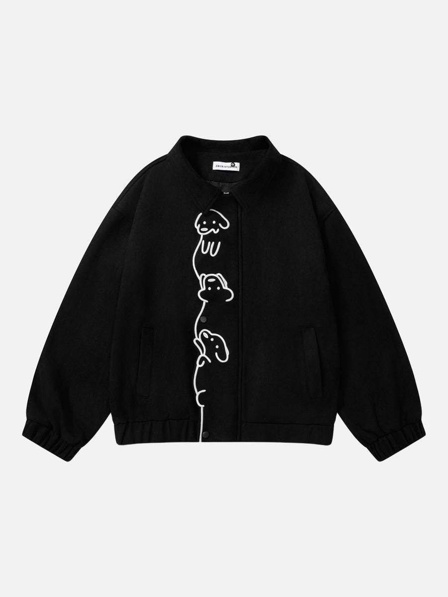 Black dog jacket featuring an abstract embroidered design on the back