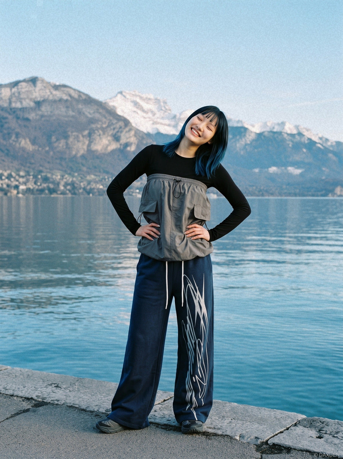 Close-up view of the abstract graphic on the sweatpants