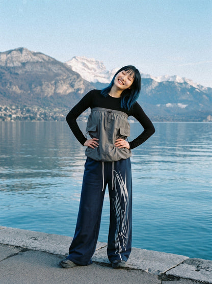 Close-up view of the abstract graphic on the sweatpants