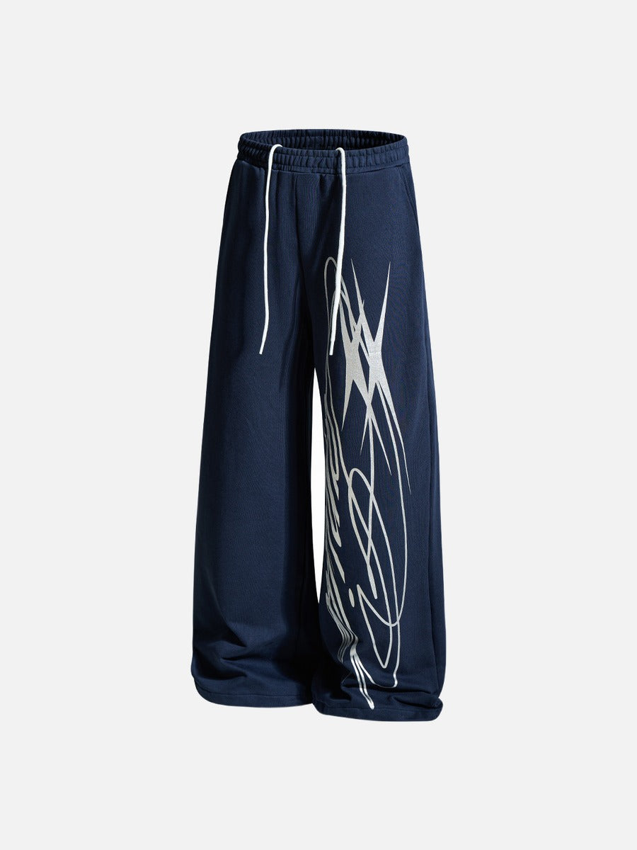 Graphic sweatpants styled as part of a relaxed streetwear outfit