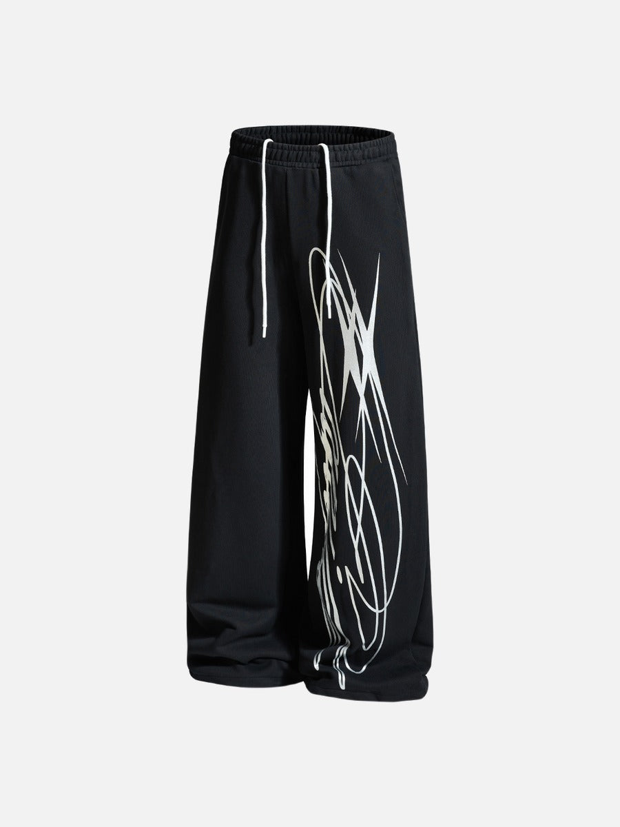 Wide-leg trousers displaying the full abstract print