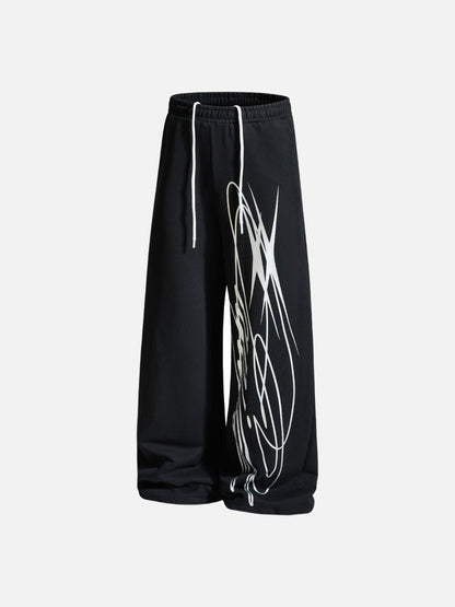 Wide-leg trousers displaying the full abstract print
