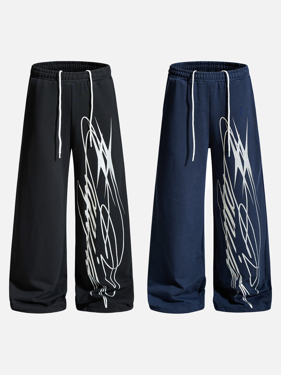 Side view of relaxed sweatpants with a graphic multi-line pattern