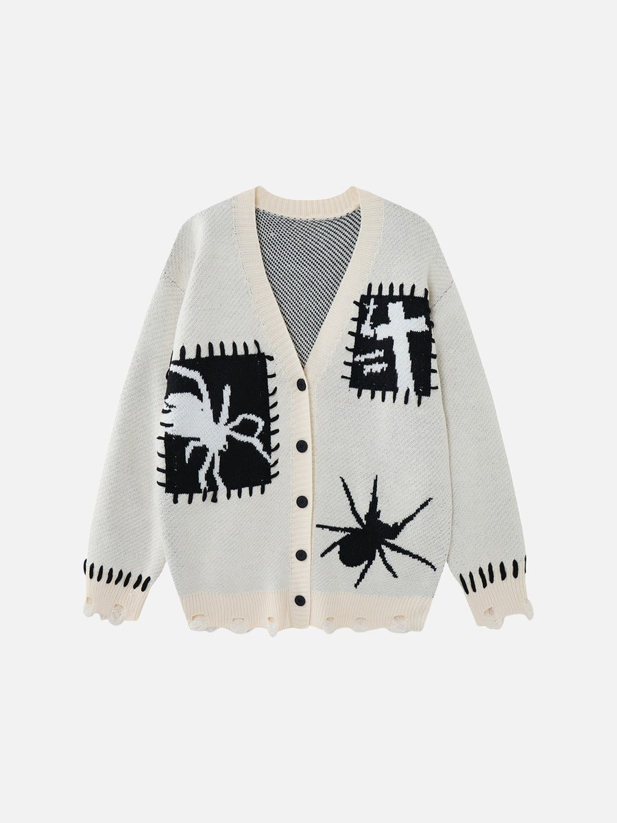 Oversized black and white graphic knit cardigan shown from the front