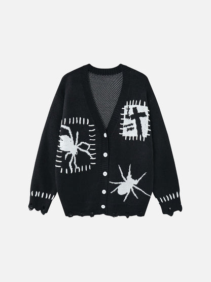 Black and white cardigan featuring an abstract spider and cross graphic