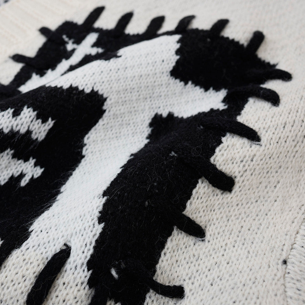 Black and white graphic cardigan styled as a casual layering piece