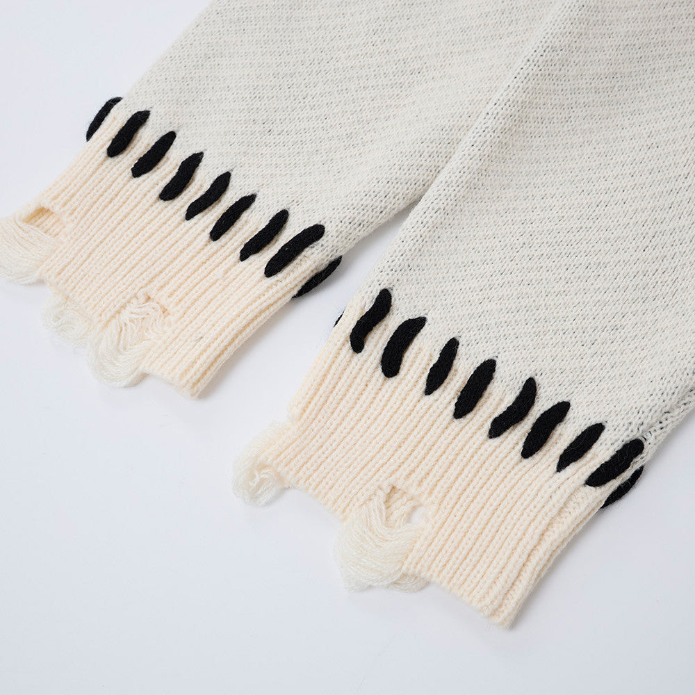Oversized knit cardigan showing its relaxed shape and long sleeves