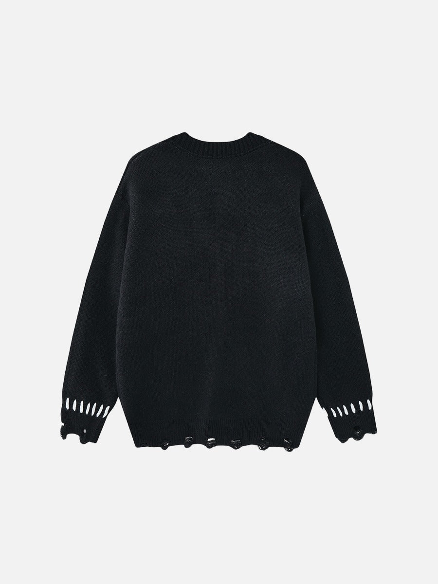Full view of the oversized graphic knit cardigan in black and white