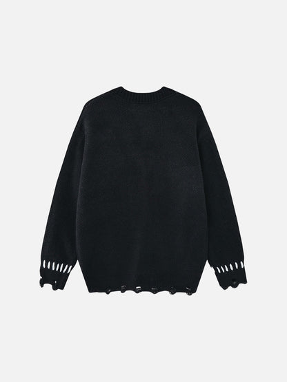 Full view of the oversized graphic knit cardigan in black and white