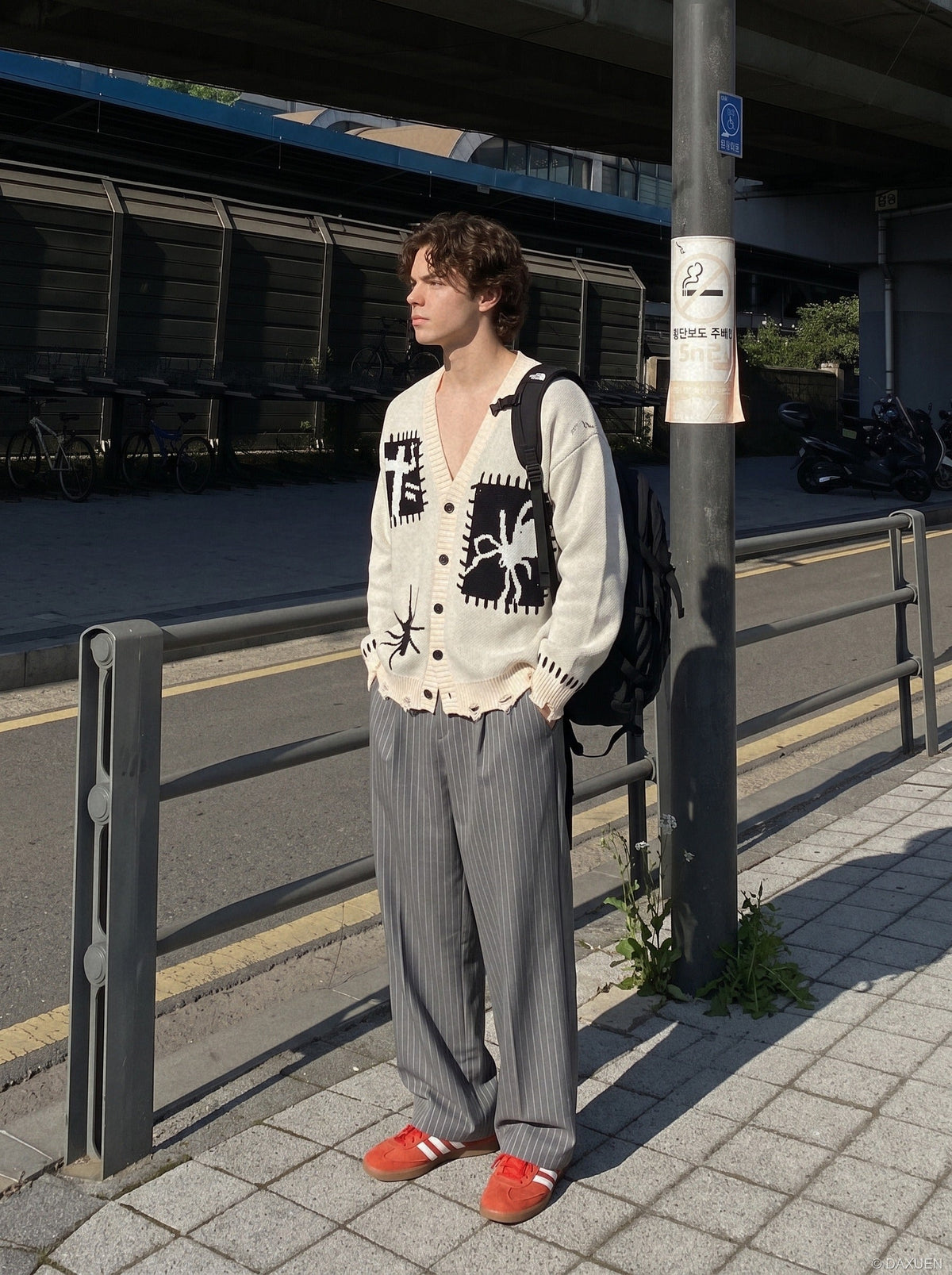 Oversized cardigan showing its black and white colour-block design