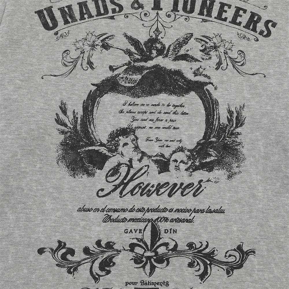 Detailed view of the decorative winged artwork on the T-shirt