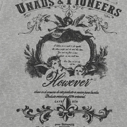 Detailed view of the decorative winged artwork on the T-shirt