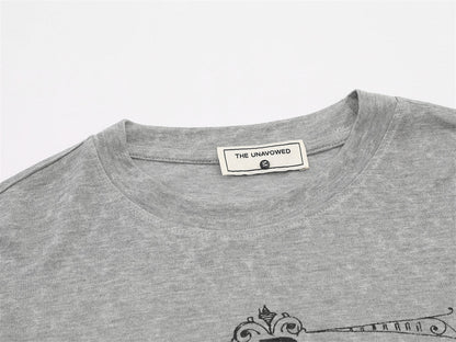 Winged graphic long-sleeve T-shirt styled with a casual streetwear outfit